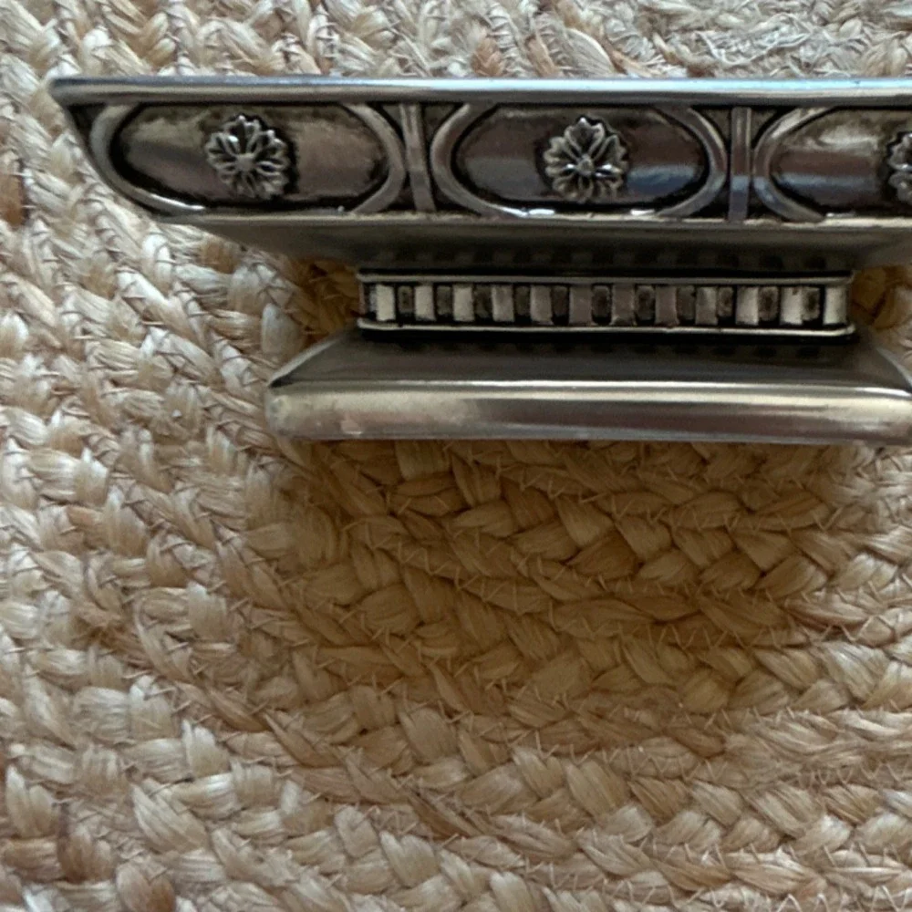 decorative silver-tone pedestal dish, likely used as a soap dish, trinket holder